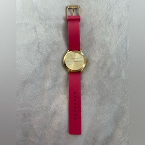Michael Kors gold face watch with red-pink toned rubber material band
